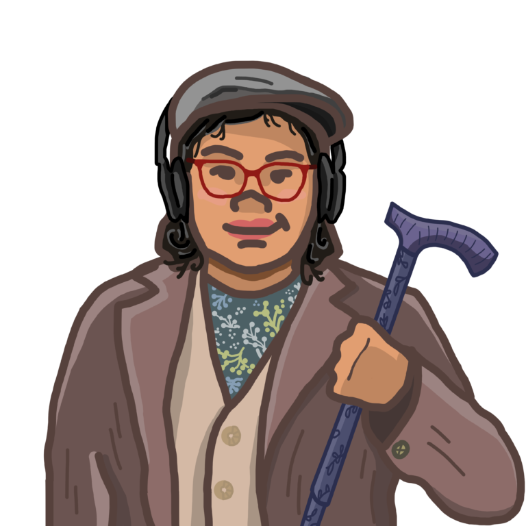 A person with medium-length black curly hair, red glasses, wearing a brown blazer and holding a walking stick.